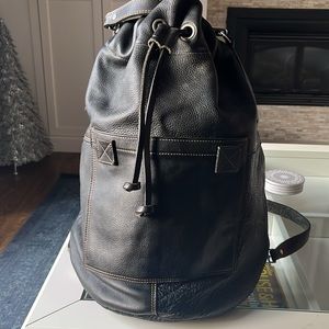 Dark brown real leather backpack

Montréal brand Rugby that became M0851